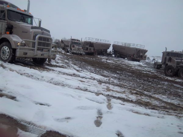 Frac Hauling on a muddy snowy location