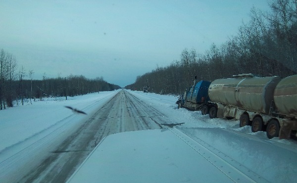 Oilfield Accidents. Crude Oil hauler in the ditch