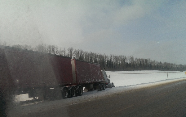 Oilfield Accidents. Curtain side trailer in ditch