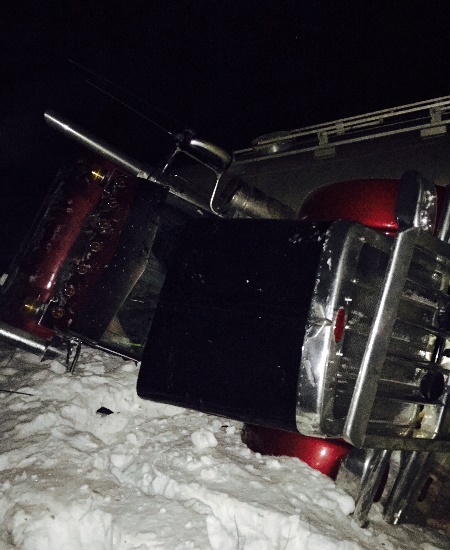 Oilfield accidents - A frac sand bulk hauler ends up in the ditch at Tommy Lakes corner on the Alaskan hwy.