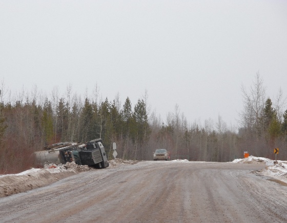 Oilfield accidents - A body job rolls onto its side on an icy Weyerhauser rd. corner