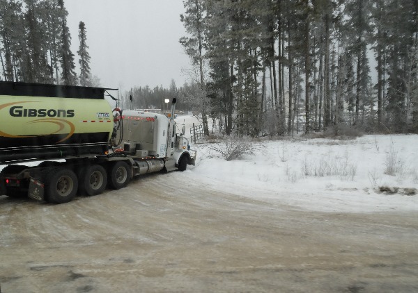 Oilfield Accidents. Tri-drive trucks are challenging on icy corners