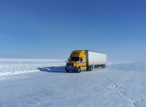 Ice road driving photos. A yellow truck sticks out against the ice road background.Team Penske seems to be everywhere don't they?