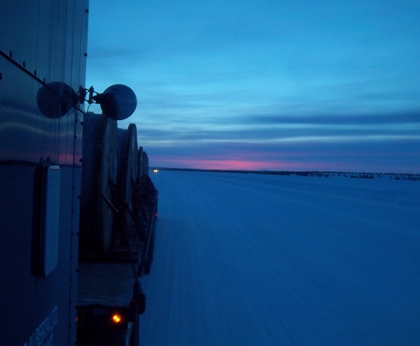 Ice Road Loads. Heading up the ice road at dusk