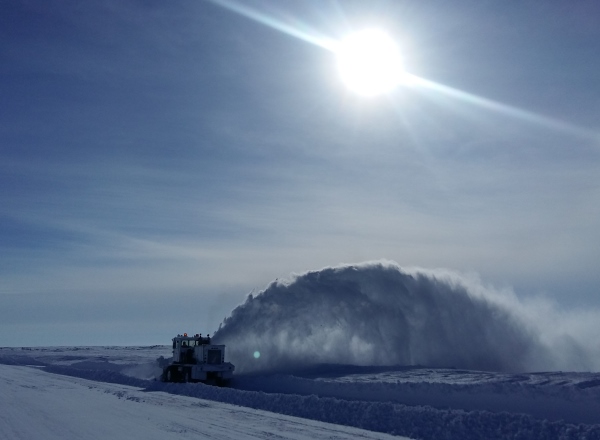 Ice road driving photos. A snowblower cleans up after 3 days of ground blizzards.
