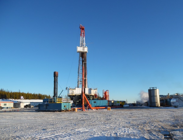 Crude Oil Hauling. A drilling rig in Northern Alberta.