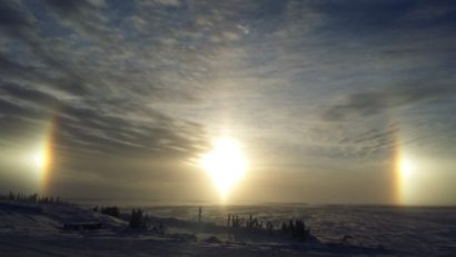 Sunrises, sunsets, sun dogs, Northern Lights and skies. Sun dog as seen from Lockhart Lake base camp on the ice roads.