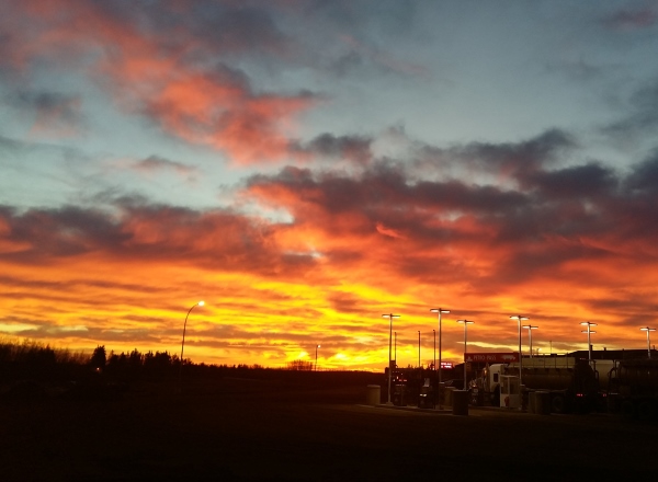 Sunrises, sunsets, sun dogs, Northern Lights and skies. Fire in the sky at sunset in Grande Prairie, Alberta.